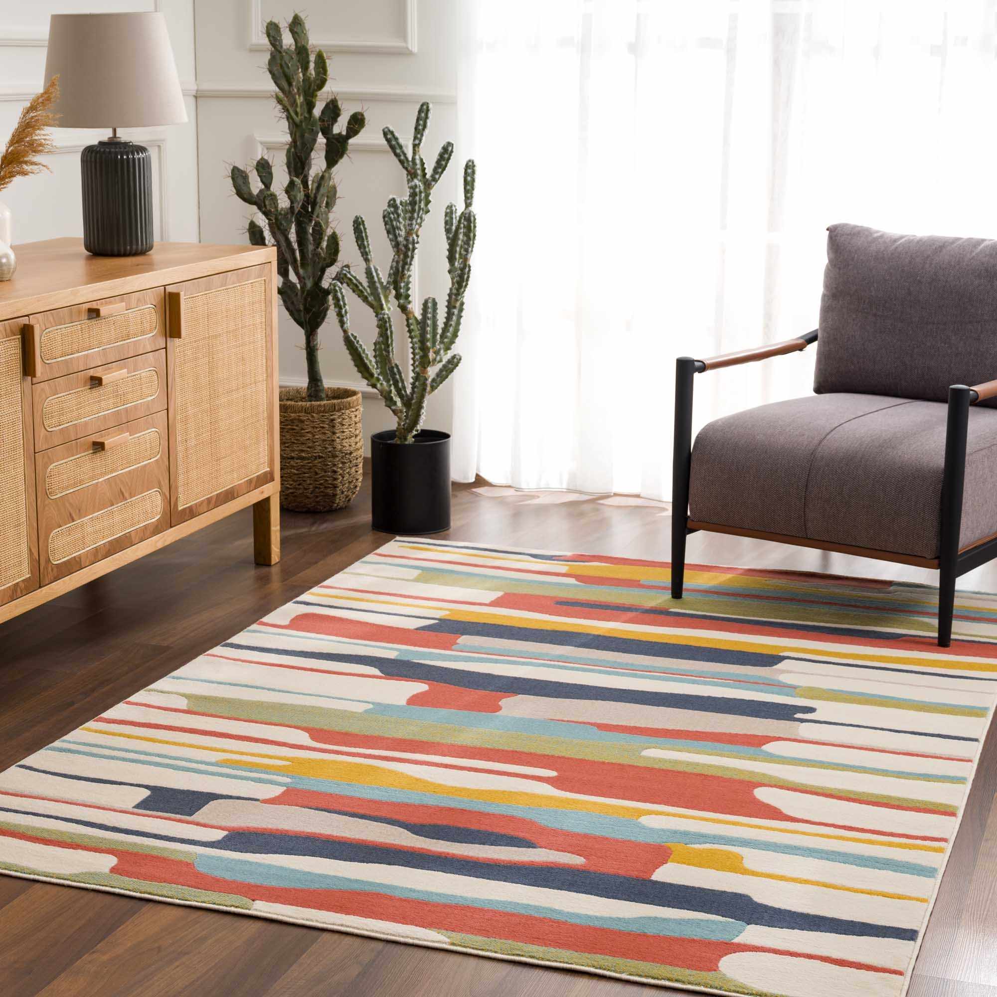 "Southfields Colorful Modern Area Carpet in a modern living room, complementing wood tones and minimalist furniture."
