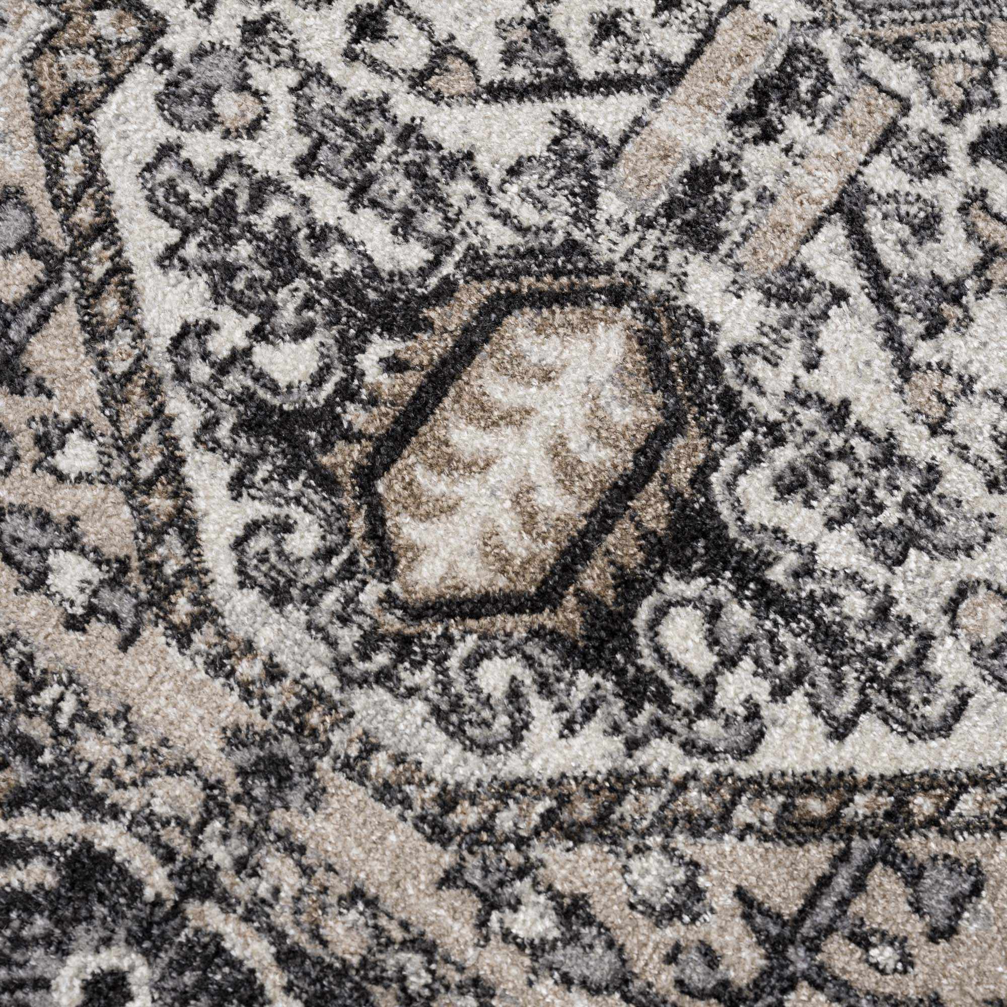 Cabacungan Washable Rug by Hauteloom styled with boots for scale. Durable and stylish for everyday use.