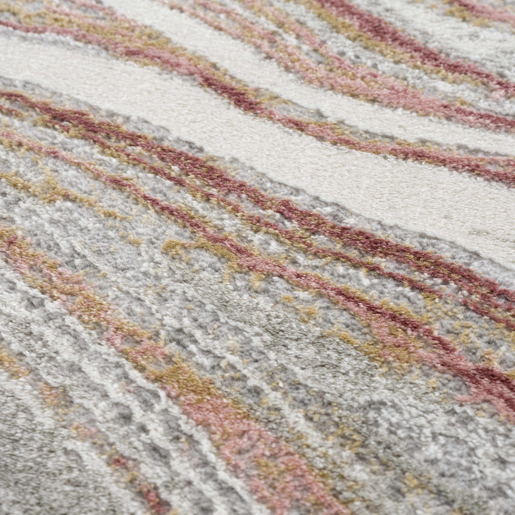 "Close-up texture of Live Marble Pink Rug showing intricate marbled design in pink, gold, and gray. Soft and durable surface."